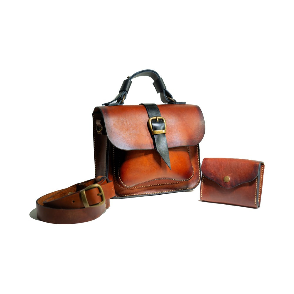 Leather handbag on white background