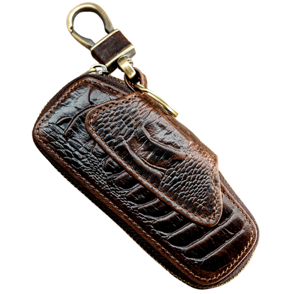A brown genuine leather car key holder with a crocodile pattern and a metal key ring.