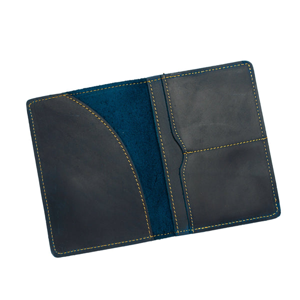 A navy blue genuine leather passport holder with a solid pattern, featuring card slots, passport holder, and a bill pocket.